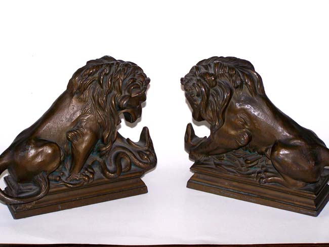 A Pair of Antique Bookends circa 1925 depicting a Lion fighting a Serpent